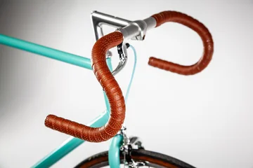 Fotobehang Fiets Hipster fixed-gear bike standing on white background, close-up  © Jacek Chabraszewski