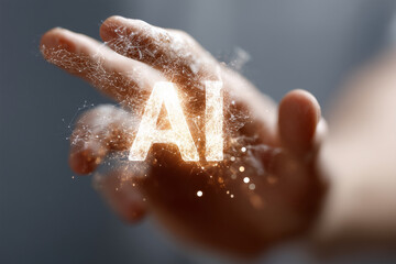 A hand is holding a glowing letter A