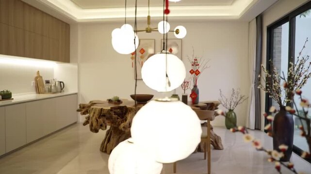 Modern dining area features a unique live edge wood table and contemporary lighting.