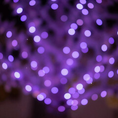 Glowing orbs and sparkling purple bokeh lights create a festive, enchanting atmosphere