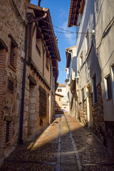 Fototapeta premium Detail of a typical narrow street in the historic center of Pastrana, Guadalajara, Castilla la Mancha, Spain