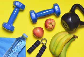 Activity and good nutrition, represented by sports accessories and fruit. Take care of yourself and...