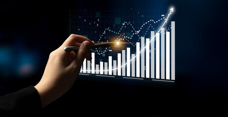 A person analyzing financial data on a digital screen, featuring charts and graphs with a rising trend in a dark background, symbolizing growth and investment. Impute