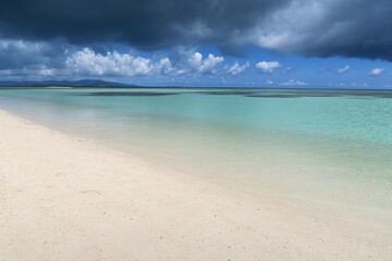 Fototapeta premium Turquoise Shallow Sea and White Sand Beach on Taketomi Island, Okinawa, Japan