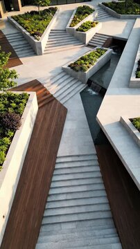 Modern architectural landscape with pathways and greenery