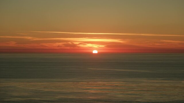 Beautiful peaceful orange pink sunset over ocean in San diego California
