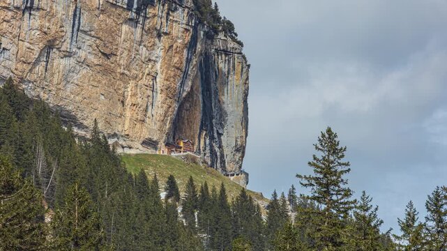 Time lapse, a historic mountain guesthouse built into a cliff. Berghaus Aescher also known as Aescher-Wildkirchli. Appenzell Innerrhoden, Switzerland