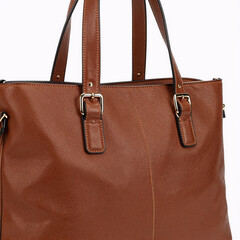 Isolated brown leather tote bag on white background