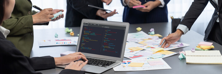 Analyst team use sticky note for creative and analytic brainstorm for business idea with BI data dashboard on laptop screen. Analysis financial data visualization tech for marketing strategy. Prodigy
