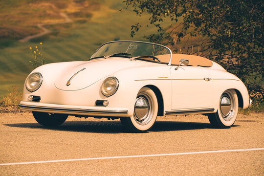 1957 Porsche 356 Speedster replica cream classic car convertible sunny day parked