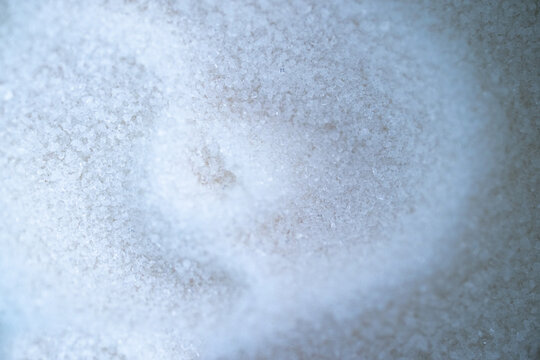Grainy white texture with ripples, ideal for 3D representations and gastronomic backgrounds.Sal o azucar esparcidas.