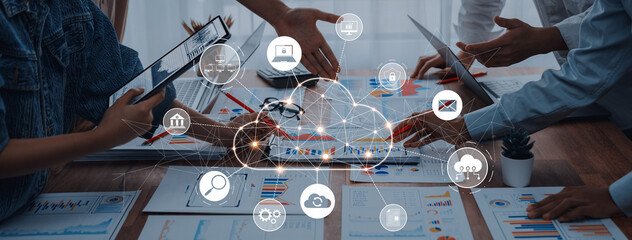 A business meeting scene showcasing collaboration with technology tools, cloud computing, and data...