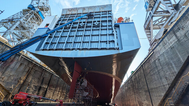 Large Cargo Vessel Hull Maintenance and Repair Inside Industrial Dry Dock