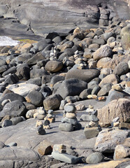 Balanced Stone Cairns on Rocky Coast at Santinho Beach, Florian&oacute;polis