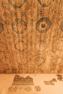 Detailed ceiling artwork in an historic building showing unique designs and patterns