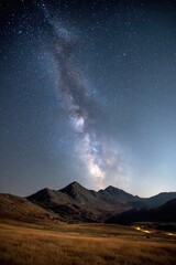 Fototapeta premium Milky Way arching over mountain range
