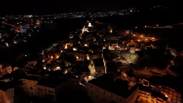 Illuminated Historic Old Town of Scalea, Italy at Night by Drone