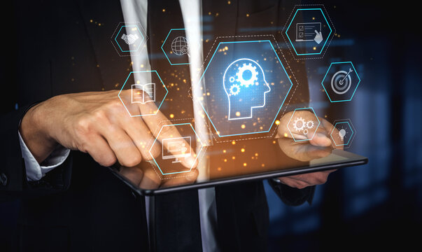 Head with gear and icons representing learning, digital training, and development process, showing skill growth for human or AI systems through knowledge or task optimization Vouch