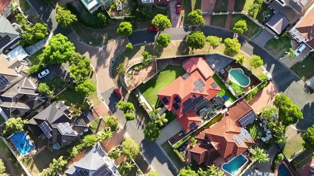 Outer south-western suburb in the City of Brisbane, Queensland, Australia &ndash; 4K aerial drone footage of residential estates, low density houses with solar panels surrounded by forest and green space 