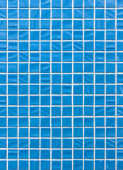 Fototapeta premium Close-up of ceramic tile texture made of small bright blue squares