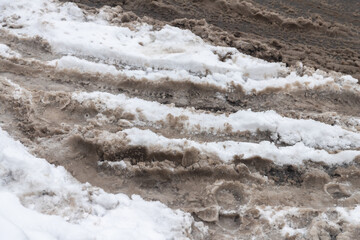 Dirty Snow and Tire Tracks Road