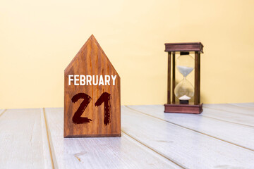 Minimalist white wooden block perpetual calendar displaying FEBRUARY 21