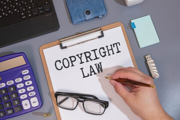 Copyright infringement - word concept on building blocks, text, letters.