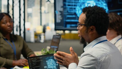 System administrators working in AI startup training predictive models for language processing tasks. Machine learning tech experts use technical expertise for complex IT requirements, camera B