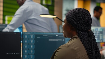 Programmer solving tasks with AI LLM chatbot answering prompts using predictive technology. Startup...