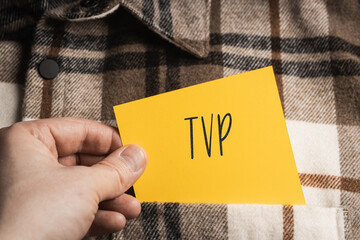 Yellow card with a handwritten inscription 