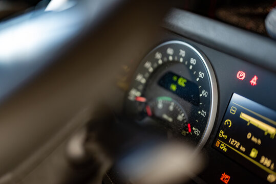 Semi-truck speedometer with mileage and fuel indicators, professional freight transport.