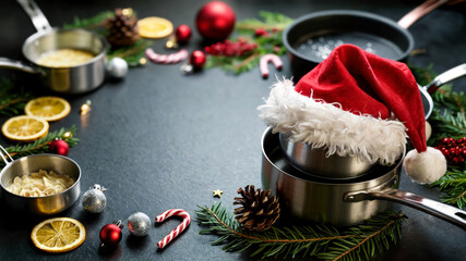 Chef's pots with Christmas decorations and festive elements for New Year