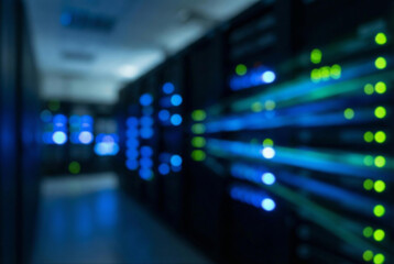 Blurred server room with blue and green lights, suggesting technology and data