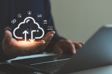 Businessman using cloud computing technology with AI data transfer icons on laptop, cybersecurity, digital storage, network connection concept for modern business, finance, enterprise IT solutions.