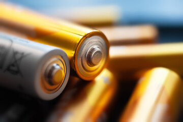 Alkaline batteries. A close-up of a pile of batteries. Macro shot