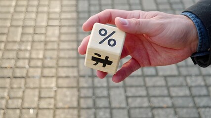 rotating wooden cube with percentage symbols and arrows in business concept | finance, business, investment, economics, strategy theme - Powered by Adobe