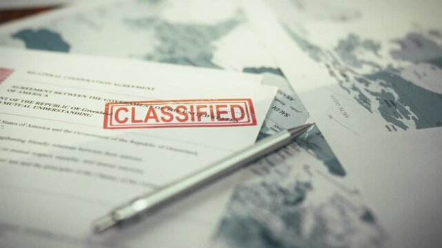 Confidential maps and cooperation agreements between countries lie on the table, stamped with a classified stamp, indicating restricted access and requiring special clearance