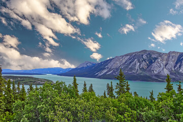 Teal waters, rugged mountains and the Bennett Lake near Bove Island, YT