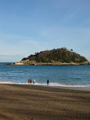 Bathers entering the sea at La Concha beach, San Sebastián, Basque Country, Spain