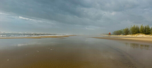 Brazil coast at sunset. Dramatic sky, dark clouds. 