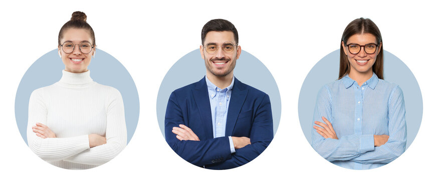 Three confident business professionals with arms crossed smiling