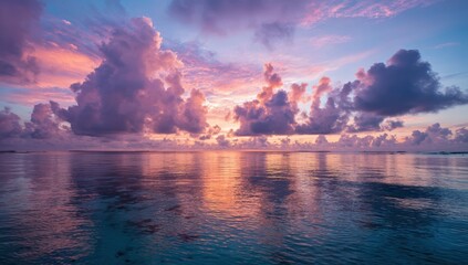 A colorful sunset over the sea creates a romantic mood with glowing skies and calm waves. The scene invites peace, reflection, and quiet moments.