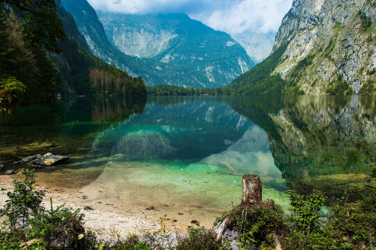 Emerald green waters of Obersee lake in the Bavarian Alps, Germany.
