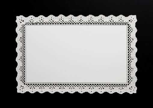 Elegant White Lace Doily On Black Background