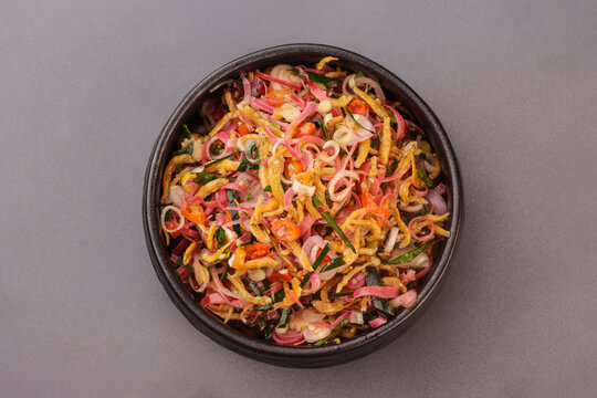 Sambal Matah with ikan teri or anchovy is a traditional Balinese raw chili relish made from sliced shallots, red chilies, lemongrass, and kaffir lime leaves, mixed with coconut oil and lime juice. 