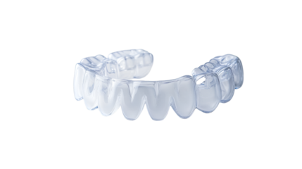 A clear dental retainer or aligner on a black background for orthodontic treatment