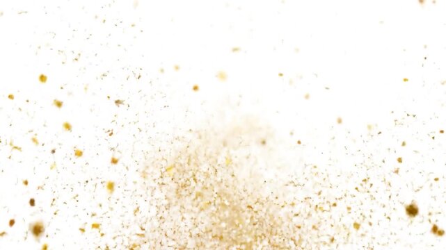 Golden particles burst outwards against a white background