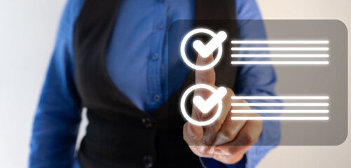 A business professional points to checkmarks on an interactive touchscreen background.