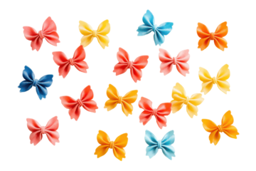 Colorful farfalle pasta scattered isolated on transparent background. Colorful farfalle pasta isolated on white background.