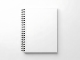 A blank spiral-bound notebook lies open on a clean white surface viewed from directly above